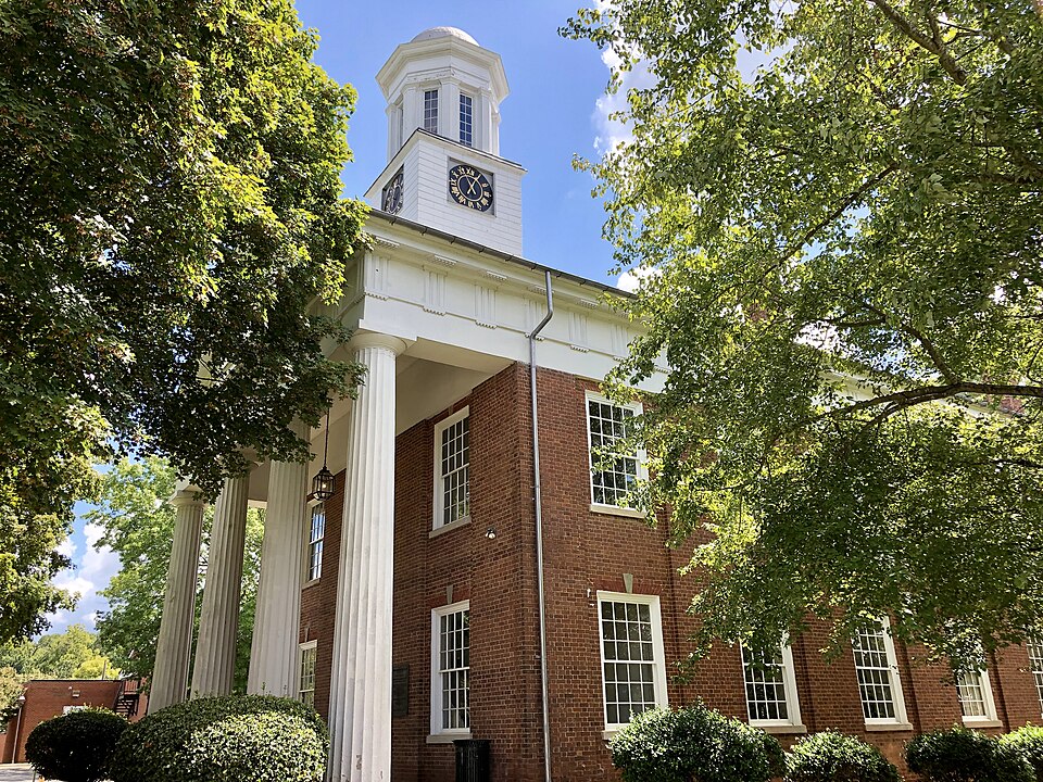 The clock tower and columns of the Old Orange County Courthouse in Hillsborough