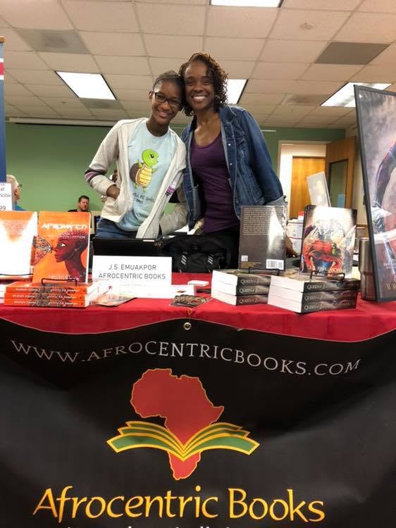 J.S. Emuakpor and guest at the Afrocentric Books table at the Local Author Book Fair.