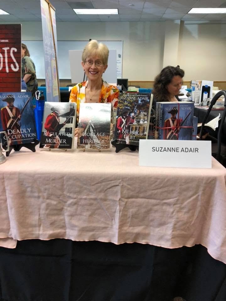 Suzanne Adair at her table at the Local Author Book Fair.